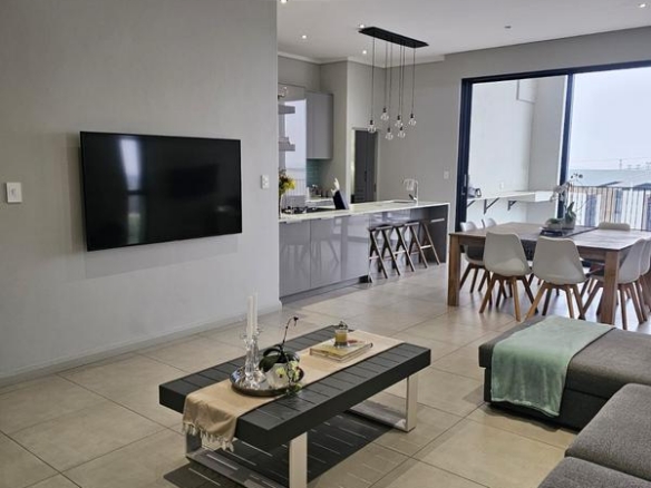 With the exquisite “Dapper in Grey” design, this Penthouse luxury apartment is perfect for those who appreciate contemporary elegance and functional luxury..