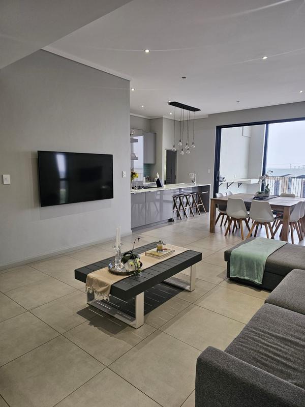 With the exquisite “Dapper in Grey” design, this Penthouse luxury apartment is perfect for those who appreciate contemporary elegance and functional luxury..