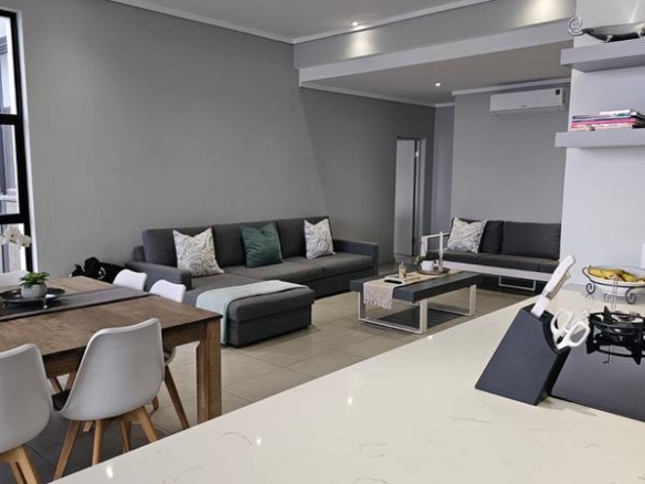 With the exquisite “Dapper in Grey” design, this Penthouse luxury apartment is perfect for those who appreciate contemporary elegance and functional luxury..