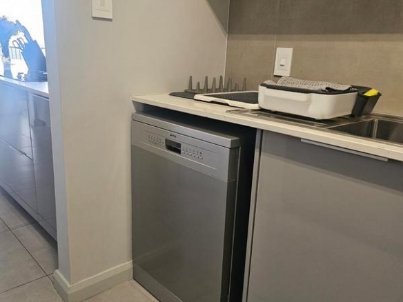 With the exquisite “Dapper in Grey” design, this Penthouse luxury apartment is perfect for those who appreciate contemporary elegance and functional luxury..