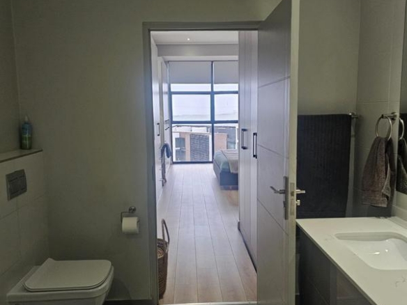 With the exquisite “Dapper in Grey” design, this Penthouse luxury apartment is perfect for those who appreciate contemporary elegance and functional luxury..