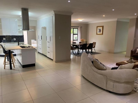 This expansive 690 sqm modern home is expertly designed with dual living in mind.  The separate wing caters for adult children or extended family with total privacy and a separate living with ample undercover parking for the entire family.