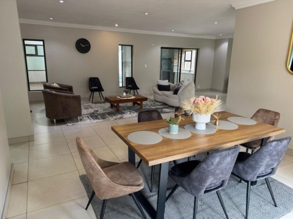 This expansive 690 sqm modern home is expertly designed with dual living in mind.  The separate wing caters for adult children or extended family with total privacy and a separate living with ample undercover parking for the entire family.