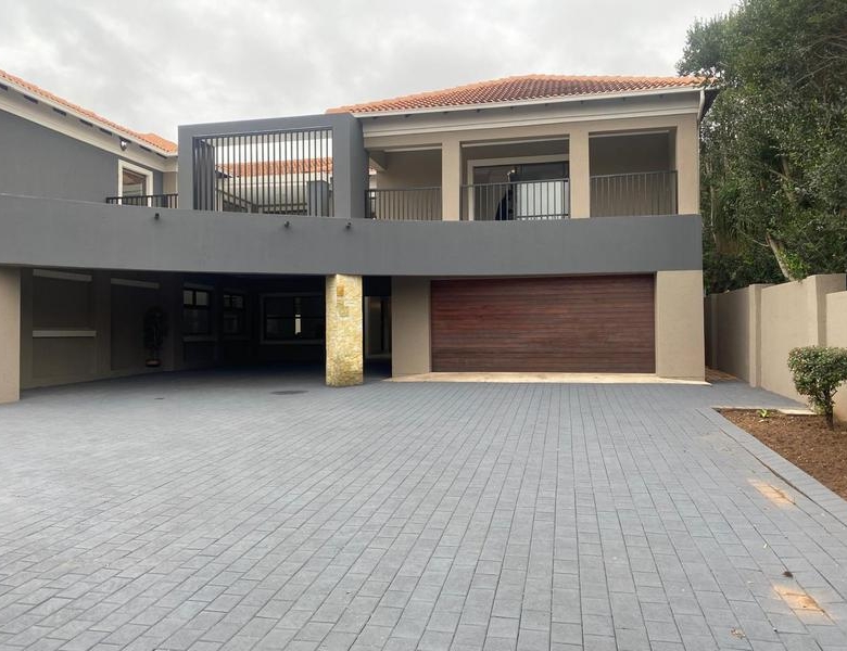 This expansive 690 sqm modern home is expertly designed with dual living in mind.  The separate wing caters for adult children or extended family with total privacy and a separate living with ample undercover parking for the entire family.