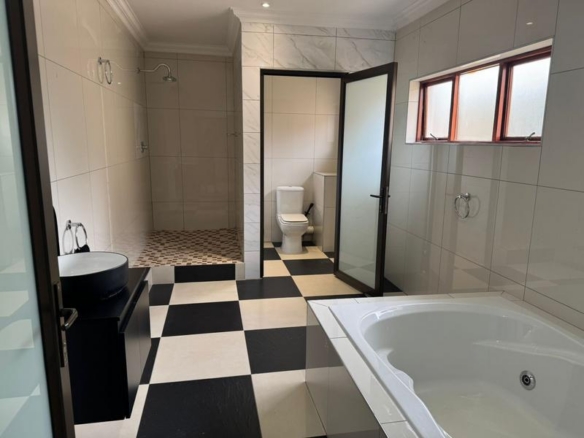 This expansive 690 sqm modern home is expertly designed with dual living in mind.  The separate wing caters for adult children or extended family with total privacy and a separate living with ample undercover parking for the entire family.