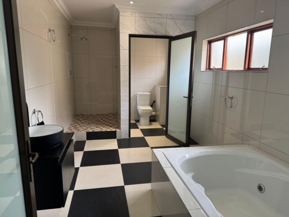 This expansive 690 sqm modern home is expertly designed with dual living in mind.  The separate wing caters for adult children or extended family with total privacy and a separate living with ample undercover parking for the entire family.