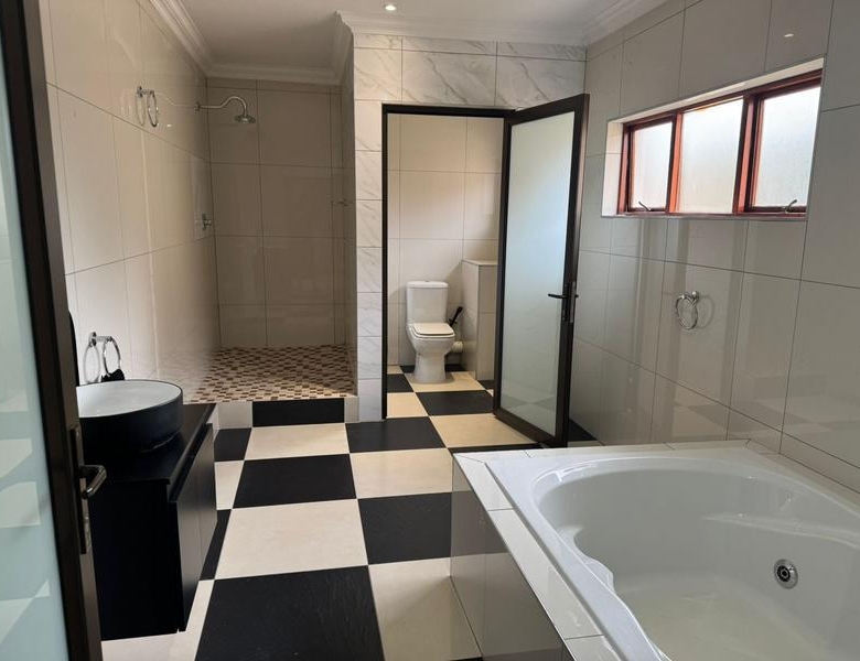 This expansive 690 sqm modern home is expertly designed with dual living in mind.  The separate wing caters for adult children or extended family with total privacy and a separate living with ample undercover parking for the entire family.