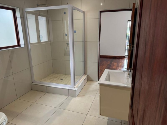 This expansive 690 sqm modern home is expertly designed with dual living in mind.  The separate wing caters for adult children or extended family with total privacy and a separate living with ample undercover parking for the entire family.