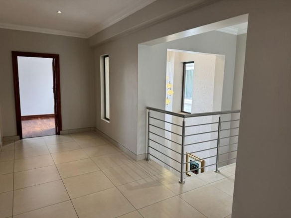 This expansive 690 sqm modern home is expertly designed with dual living in mind.  The separate wing caters for adult children or extended family with total privacy and a separate living with ample undercover parking for the entire family.