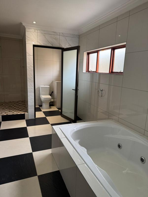This expansive 690 sqm modern home is expertly designed with dual living in mind.  The separate wing caters for adult children or extended family with total privacy and a separate living with ample undercover parking for the entire family.