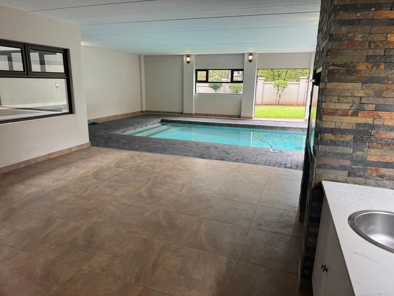 This expansive 690 sqm modern home is expertly designed with dual living in mind.  The separate wing caters for adult children or extended family with total privacy and a separate living with ample undercover parking for the entire family.