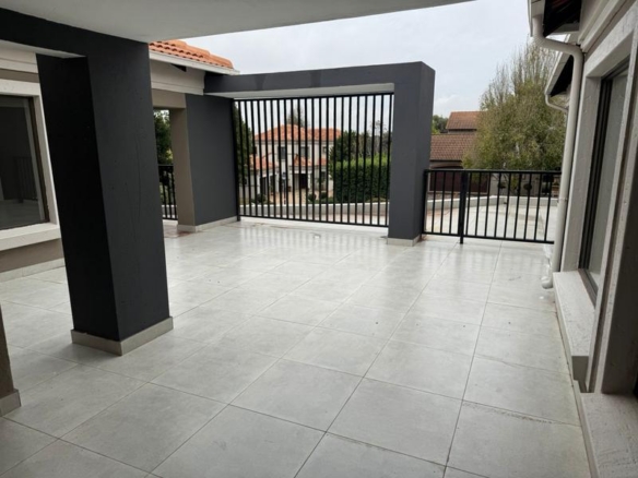 This expansive 690 sqm modern home is expertly designed with dual living in mind.  The separate wing caters for adult children or extended family with total privacy and a separate living with ample undercover parking for the entire family.