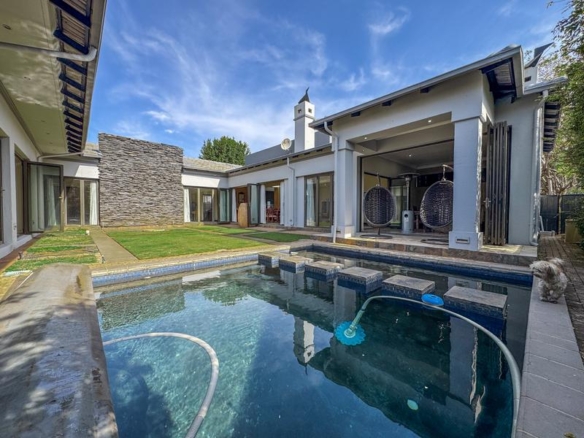 Large family home with exceptional design in the heart of Old Midstream.  Walking distance to school.