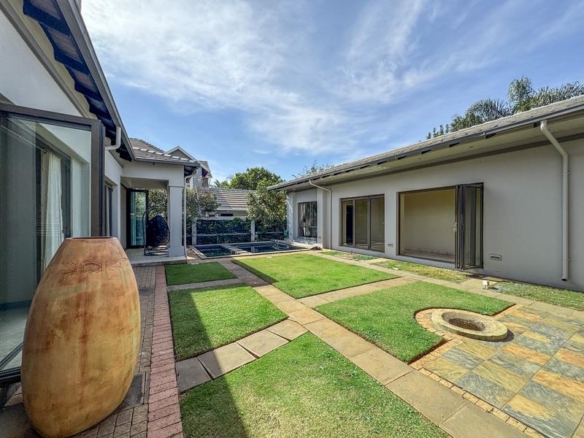 Large family home with exceptional design in the heart of Old Midstream.  Walking distance to school.