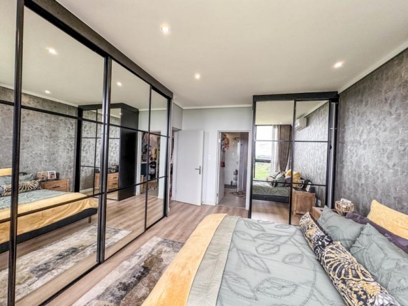 Exclusive Luxury corner apartment for sale at Ascend to Midstream with spectacular golf course and pond views.