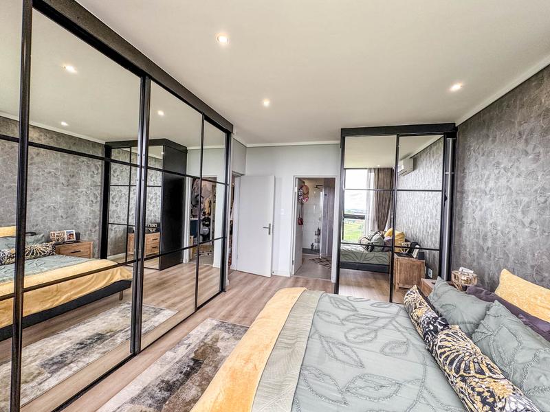 Exclusive Luxury corner apartment for sale at Ascend to Midstream with spectacular golf course and pond views.