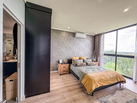 Exclusive Luxury corner apartment for sale at Ascend to Midstream with spectacular golf course and pond views.