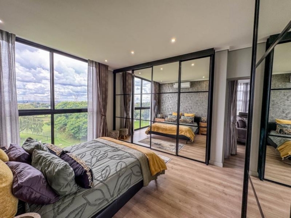 Exclusive Luxury corner apartment for sale at Ascend to Midstream with spectacular golf course and pond views.